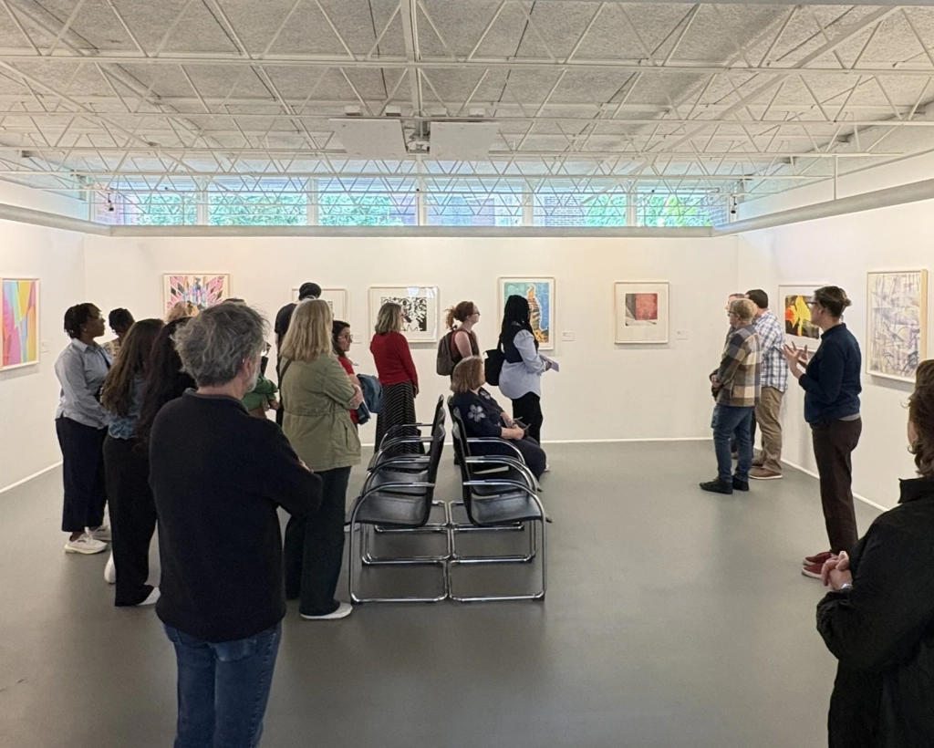 A tour group in the galleries at The Print Center